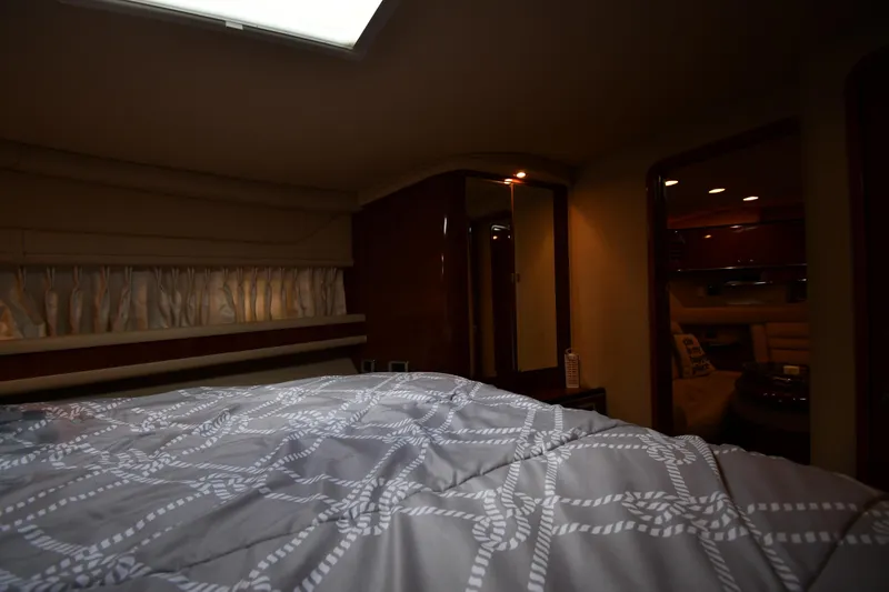  Yacht Photos Pics Interior cabin of 2003 Sea Ray 460 Sundancer yacht with bed and ambient lighting.