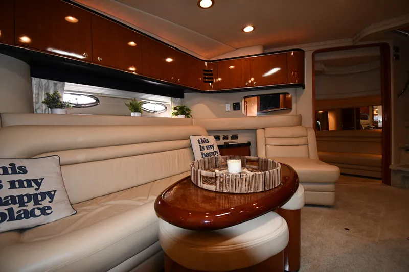  Yacht Photos Pics Luxurious interior of 2003 Sea Ray 460 Sundancer yacht with elegant seating and decor.
