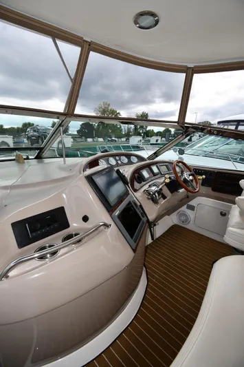  Yacht Photos Pics 2003 Sea Ray 460 Sundancer helm with modern controls and panoramic windows.