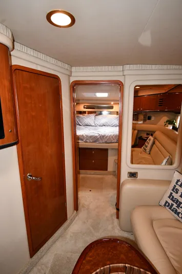  Yacht Photos Pics Interior of 2003 Sea Ray 460 Sundancer yacht, featuring cozy cabin and elegant wood finishes.