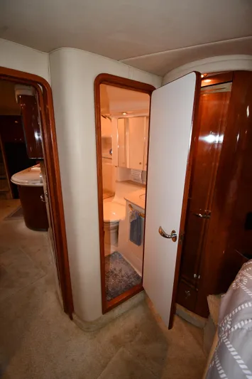  Yacht Photos Pics Interior of 2003 Sea Ray 460 Sundancer yacht, featuring a bathroom and wooden cabinetry.
