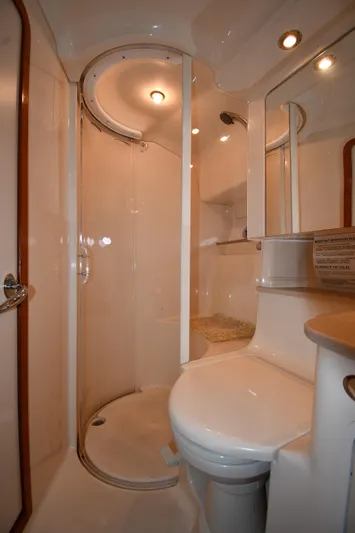  Yacht Photos Pics Bathroom interior of 2003 Sea Ray 460 Sundancer yacht, featuring shower and toilet.