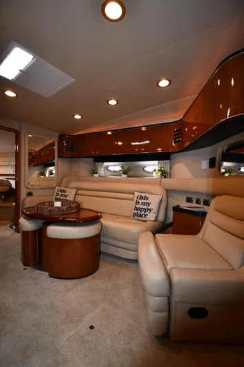  Yacht Photos Pics Luxurious interior of a 2003 Sea Ray 460 Sundancer yacht with plush seating and elegant design.