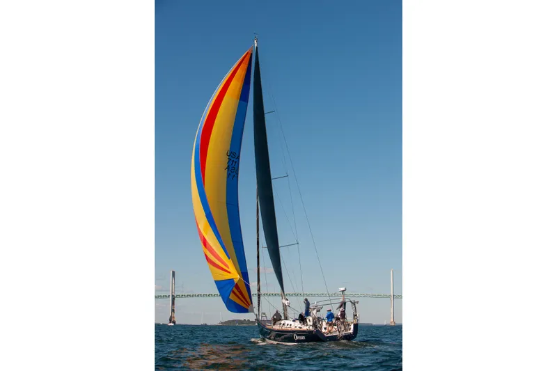  Yacht Photos Pics Sailing yacht X-Yachts X-50 (2006) with colorful spinnaker on open water.