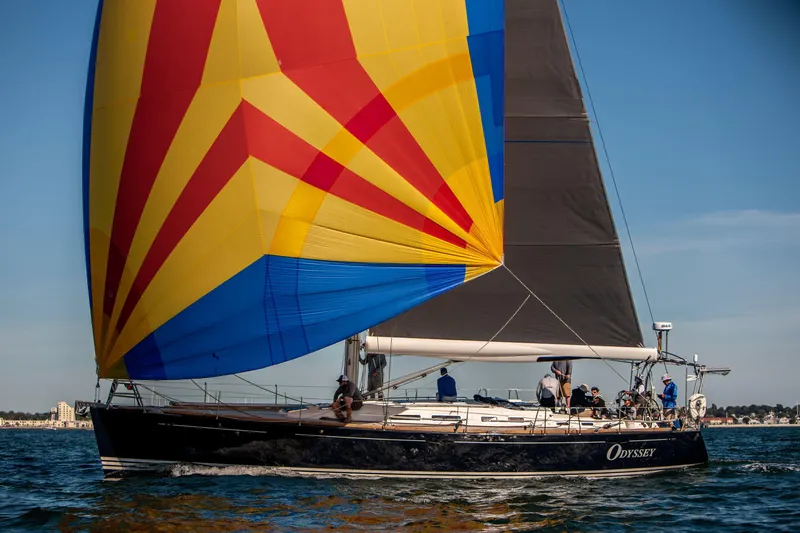  Yacht Photos Pics 2006 X-Yachts X-50 sailboat with colorful spinnaker sailing on open water.