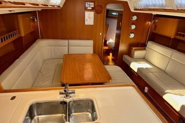  Yacht Photos Pics Luxurious 2006 X-Yachts X-50 interior with elegant wood finish and comfortable seating.