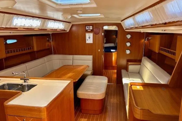  Yacht Photos Pics Luxurious 2006 X-Yachts X-50 interior with elegant wood finish and spacious seating.