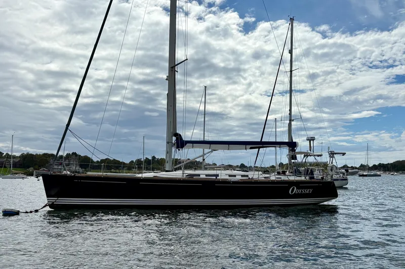  Yacht Photos Pics 2006 X-Yachts X-50 sailboat named Odyssey on calm water under cloudy sky.