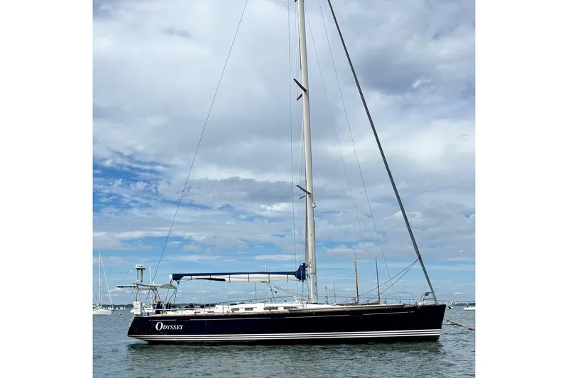  Yacht Photos Pics 2006 X-Yachts X-50 sailboat on calm water under a cloudy sky.
