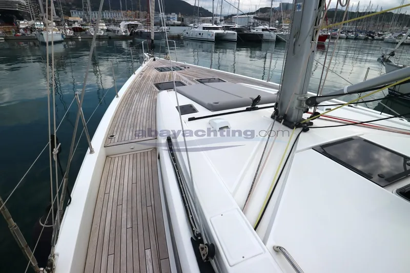  Yacht Photos Pics 2023 Beneteau Oceanis 54 yacht docked in marina, showcasing sleek deck design.
