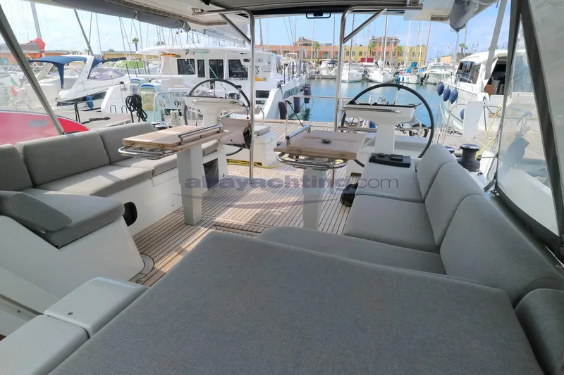  Yacht Photos Pics 2023 Beneteau Oceanis 54 yacht interior with spacious seating and dual steering wheels.