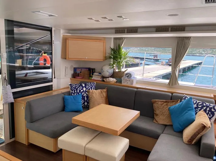 The Recipe Yacht Photos Pics Luxurious Lagoon 560 yacht interior, 2011 model, featuring cozy seating and elegant decor.