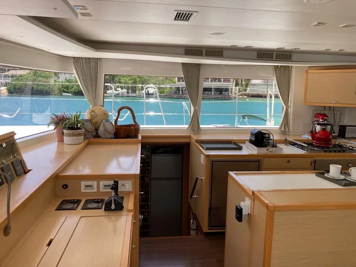 The Recipe Yacht Photos Pics Interior of 2011 Lagoon 560 yacht with modern kitchen and scenic water view.