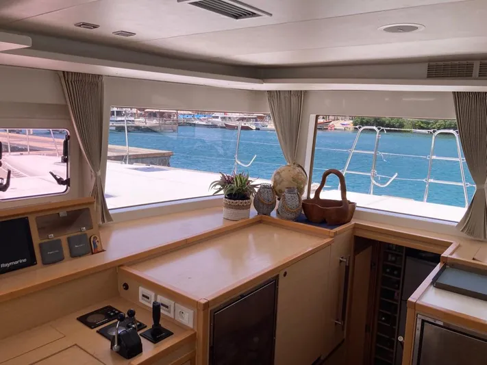 The Recipe Yacht Photos Pics Interior view of 2011 Lagoon 560 yacht with ocean view through large windows.