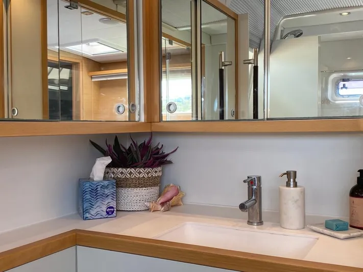 The Recipe Yacht Photos Pics Luxurious bathroom on 2011 Lagoon 560 yacht with modern fixtures and elegant decor.