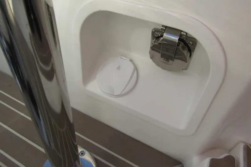  Yacht Photos Pics 2023 Windy SR28 CC boat compartment with metal latch and cover.