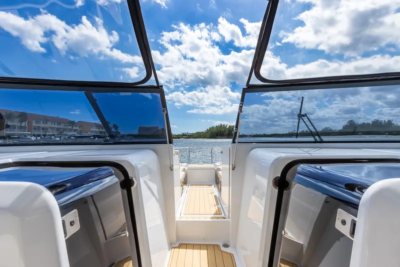 Yaffa Yacht Photos Pics Aquila 36 boat interior with open deck, blue sky, and water view.