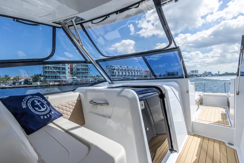 Yaffa Yacht Photos Pics Aquila 36 yacht interior with modern seating, large windows, and ocean view.