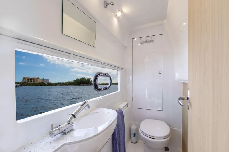 Yaffa Yacht Photos Pics Luxurious bathroom in 2021 Aquila 36 yacht with scenic water view.