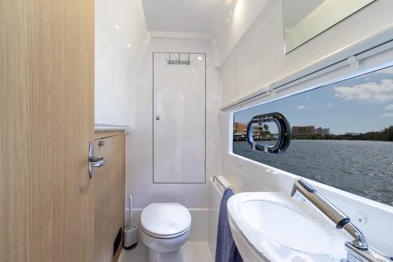 Yaffa Yacht Photos Pics Modern bathroom interior on 2021 Aquila 36 yacht with scenic water view.