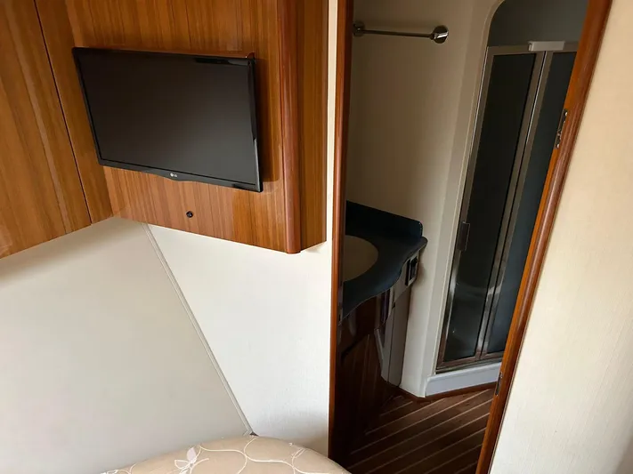 No Name Yacht Photos Pics Interior of 2008 Viking Convertible 60 yacht with TV and bathroom view.