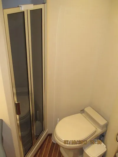 No Name Yacht Photos Pics Bathroom with shower and toilet in 2008 Viking Convertible 60 yacht.