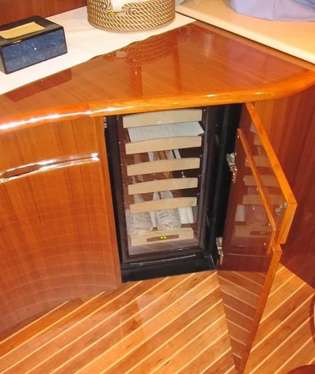 No Name Yacht Photos Pics Luxury wooden cabinet with built-in wine cooler on Viking Convertible 60 yacht.