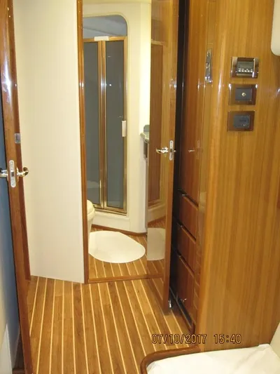 No Name Yacht Photos Pics Interior of 2008 Viking Convertible 60 yacht with wooden flooring and bathroom.