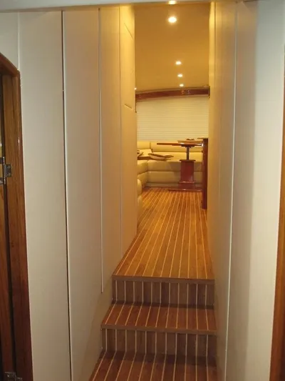 No Name Yacht Photos Pics Interior of 2008 Viking Convertible 60 yacht with wooden flooring and cozy seating area.