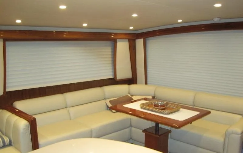 No Name Yacht Photos Pics Luxurious interior of 2008 Viking Convertible 60 yacht with plush seating and elegant table.
