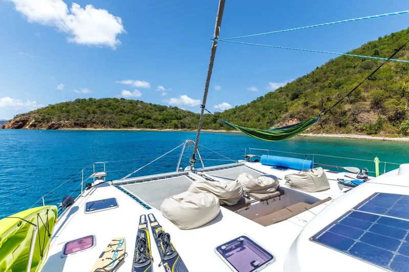 Azuria Yacht Photos Pics Lagoon 500 catamaran deck with hammock, bean bags, and scenic island view.