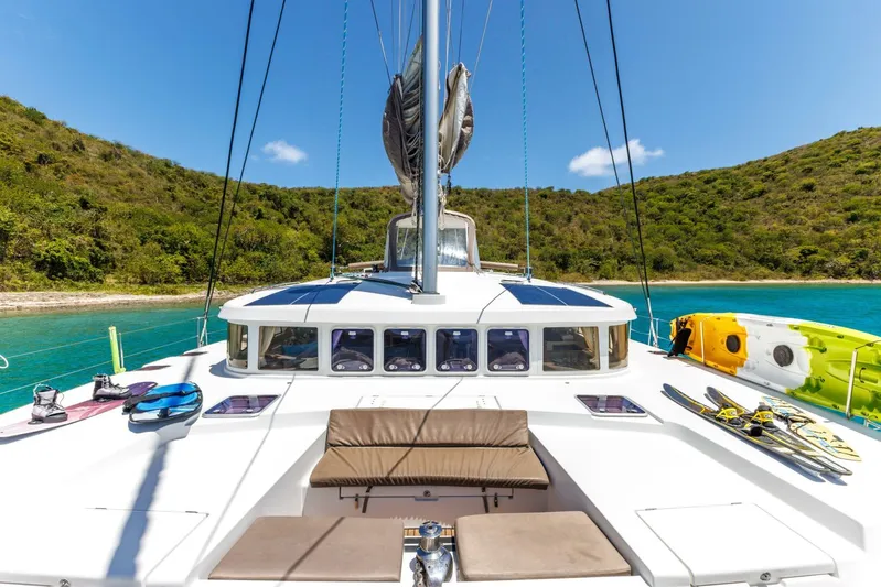 Azuria Yacht Photos Pics 2011 Lagoon 500 catamaran anchored in a scenic bay with clear blue water.