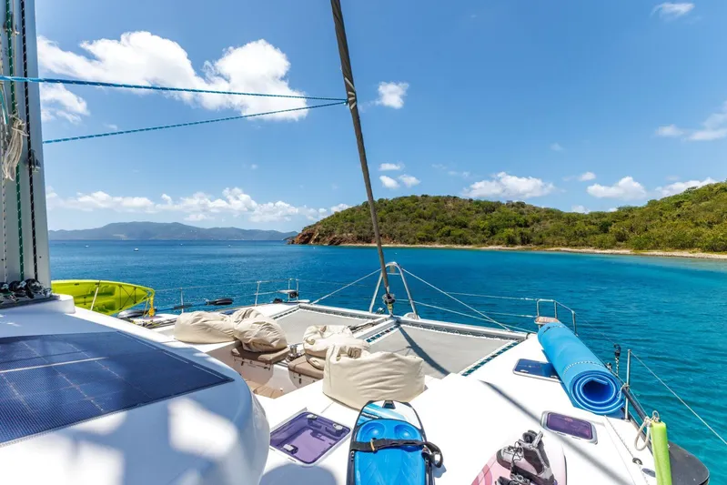 Azuria Yacht Photos Pics Lagoon 500 catamaran anchored near tropical island, clear blue water, sunny day, 2011 model.