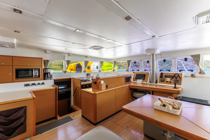 Azuria Yacht Photos Pics Spacious interior of 2011 Lagoon 500 catamaran with modern kitchen and navigation area.