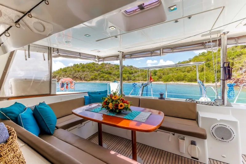 Azuria Yacht Photos Pics Luxurious Lagoon 500 yacht interior with elegant seating, table, and scenic ocean view, 2011 model.