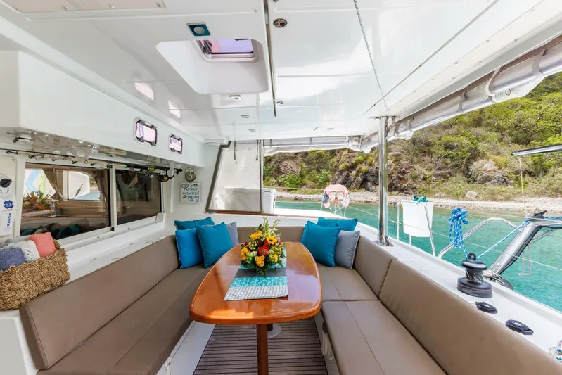 Azuria Yacht Photos Pics Luxurious Lagoon 500 yacht interior with seating, table, and scenic ocean view, 2011 model.