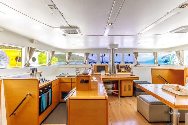 Azuria Yacht Photos Pics Spacious interior of 2011 Lagoon 500 catamaran with modern kitchen and dining area.