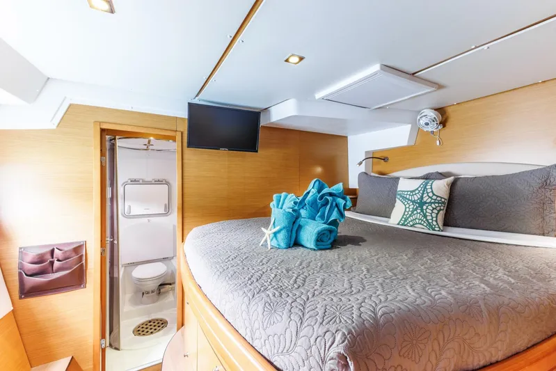 Azuria Yacht Photos Pics Luxurious cabin interior of 2011 Lagoon 500 yacht with cozy bed and ensuite bathroom.