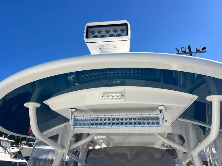 Why Knot II Yacht Photos Pics 2018 Regulator 34SS with LED lights under blue sky.