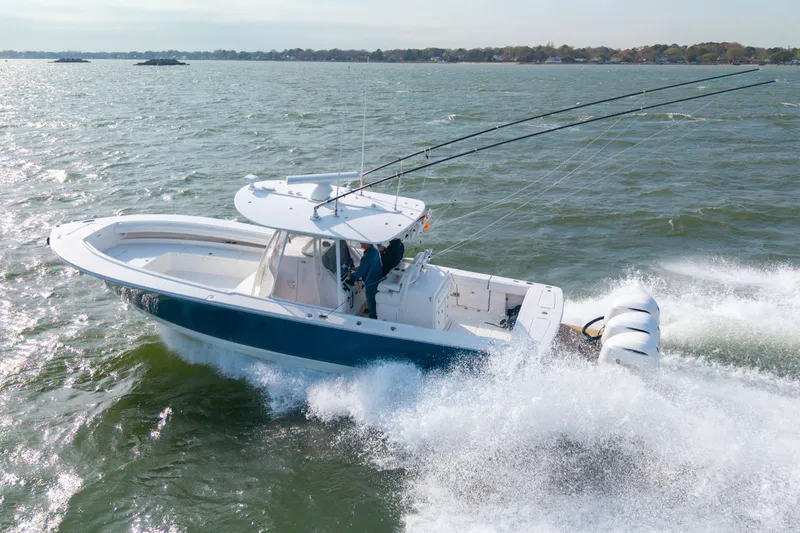 Why Knot II Yacht Photos Pics 2018 Regulator 34SS boat navigating choppy waters.