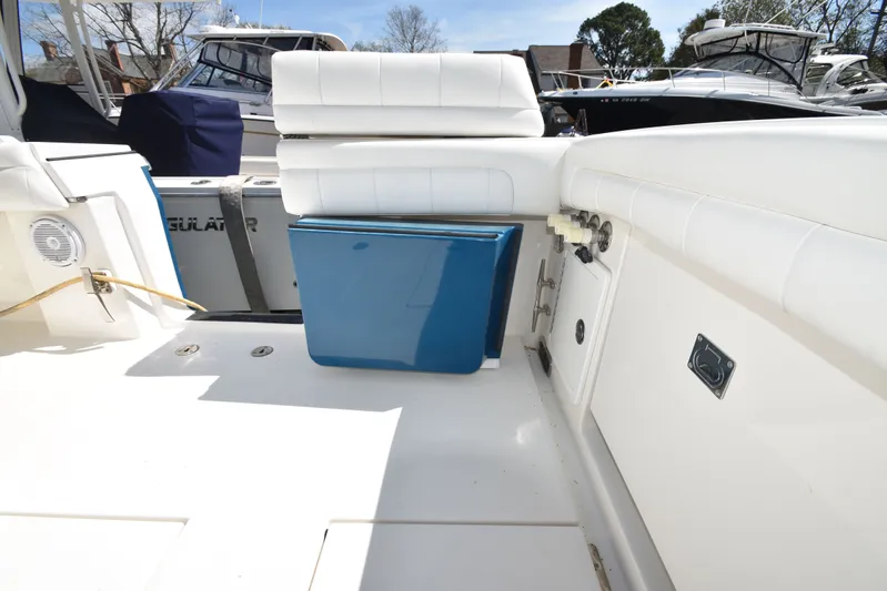 Why Knot II Yacht Photos Pics Interior of a 2018 Regulator 34SS boat with blue cooler.