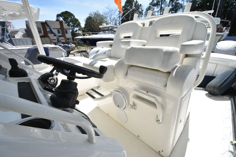 Why Knot II Yacht Photos Pics Interior view of a 2018 Regulator 34SS boat with helm station.