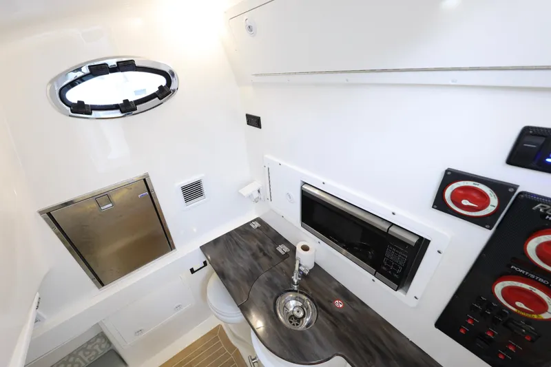 Why Knot II Yacht Photos Pics Interior of 2018 Regulator 34SS with sink and microwave.
