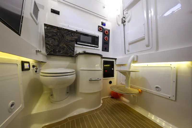 Why Knot II Yacht Photos Pics Interior of 2018 Regulator 34SS with toilet and microwave.