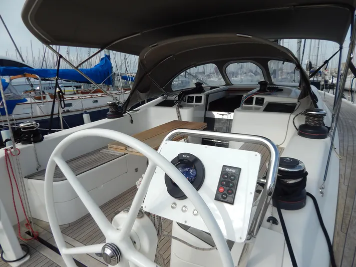  Yacht Photos Pics Italia Yachts 13.98 (2021) sailboat cockpit with steering wheel and navigation controls.