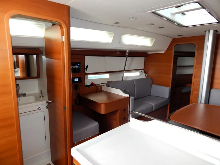 Yacht Photos Pics Luxurious interior of 2021 Italia Yachts 13.98, featuring modern wood finishes and comfortable seating.