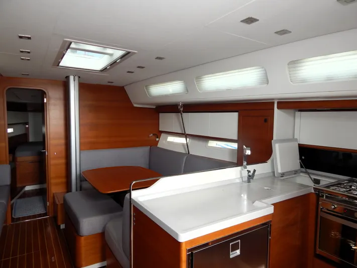  Yacht Photos Pics Italia Yachts 13.98 (2021) interior with modern kitchen and dining area.