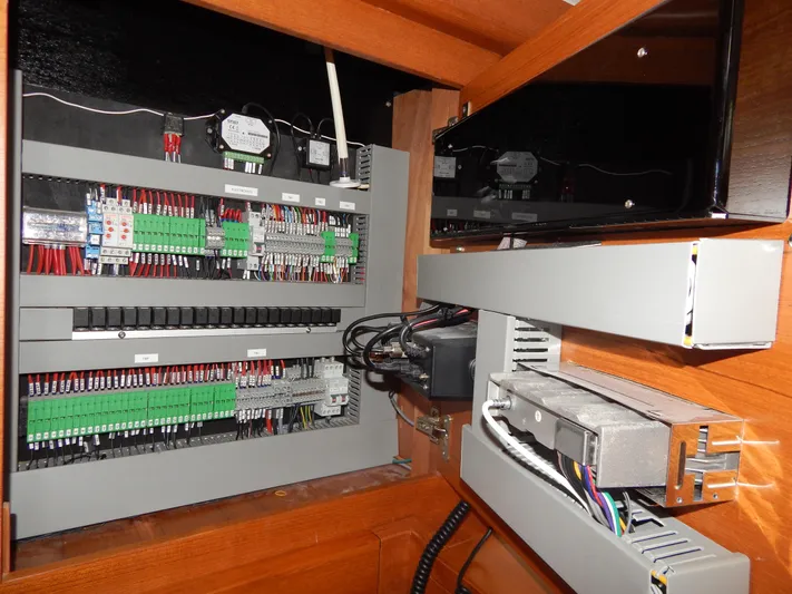  Yacht Photos Pics Electrical panel inside a 2021 Italia Yachts 13.98, showcasing wiring and components.