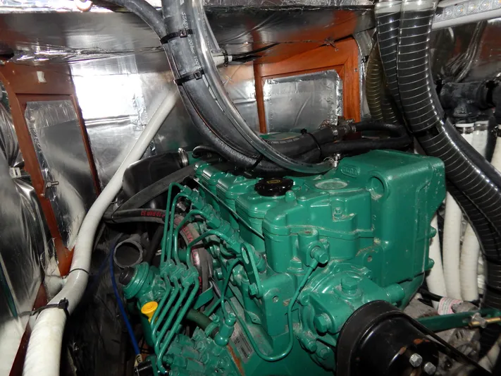  Yacht Photos Pics Engine room of 2021 Italia Yachts 13.98, featuring a green marine engine.