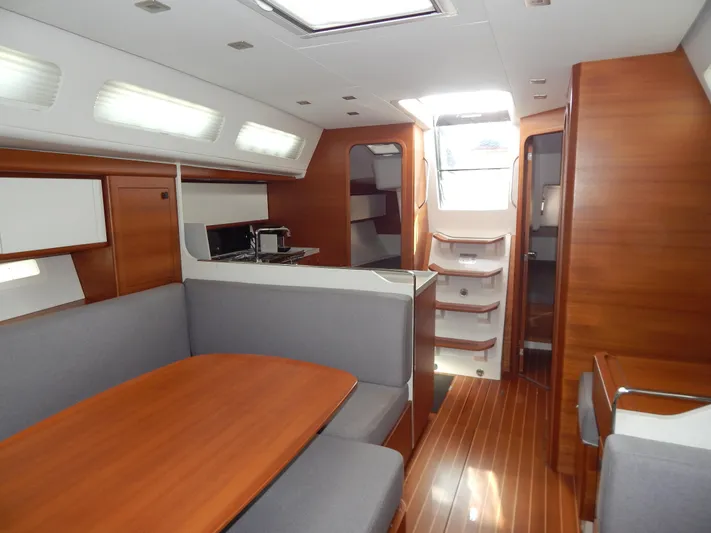  Yacht Photos Pics Italia Yachts 13.98 2021 interior with modern wood finish and spacious seating area.
